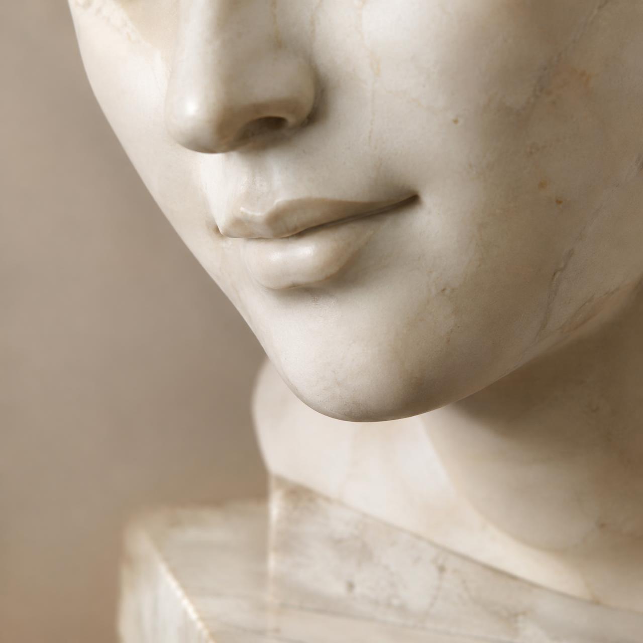 Marble sculpture study of a calm, healthy smile